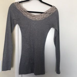 Form hugging off shoulder sweater